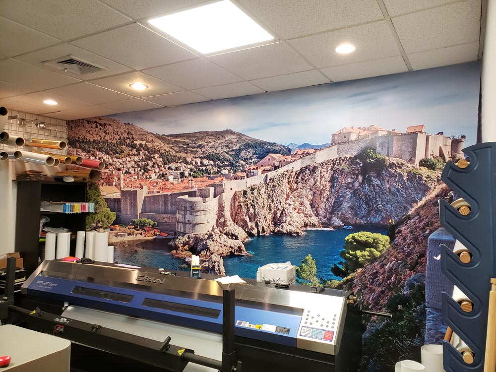 full wall graphic of the coast in Croatia, decorating Sign Design’s print room
